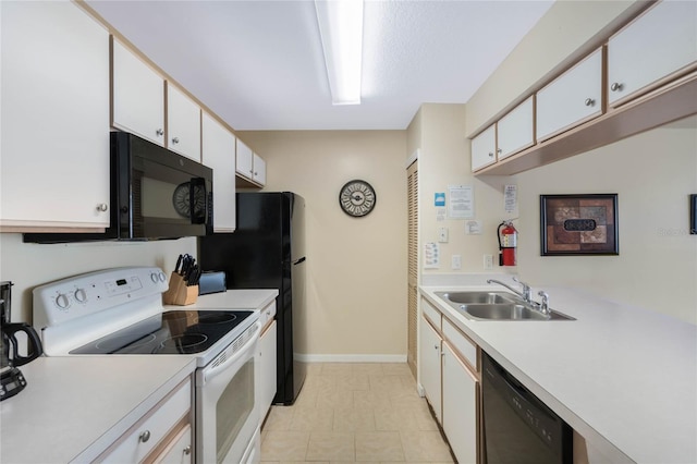 kitchen with white cabinetry, sink, and black appliances