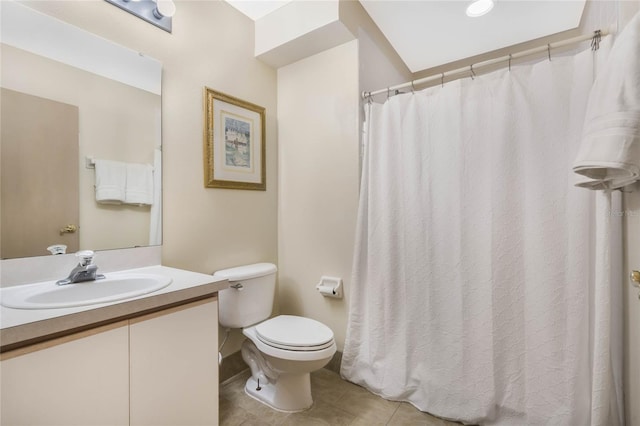 bathroom with tile patterned floors, vanity, and toilet