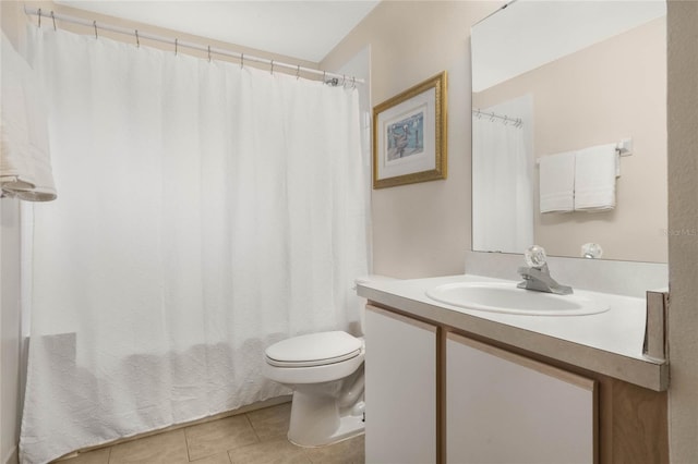 bathroom featuring tile patterned flooring, vanity, and toilet