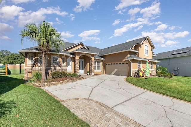 view of front of home with a porch, a garage, and a front yard