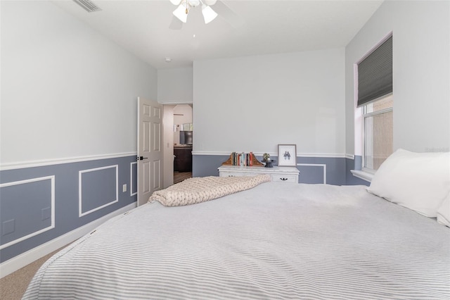 bedroom with ceiling fan and carpet flooring