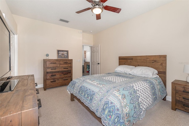 carpeted bedroom featuring ceiling fan and a closet