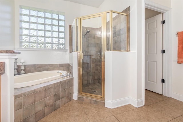 bathroom featuring tile patterned floors and plus walk in shower