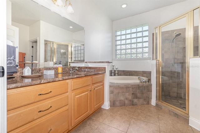 bathroom featuring vanity, tile patterned floors, and independent shower and bath