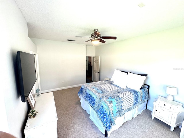 bedroom featuring carpet floors, a ceiling fan, visible vents, and baseboards