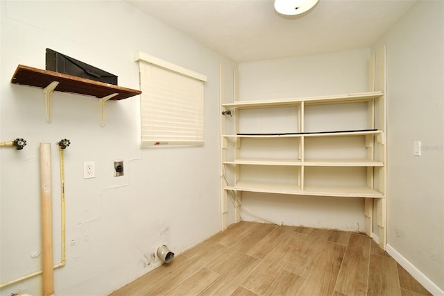 clothes washing area with electric dryer hookup and gas dryer hookup