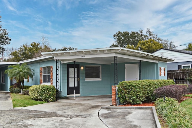 view of front of property with a carport