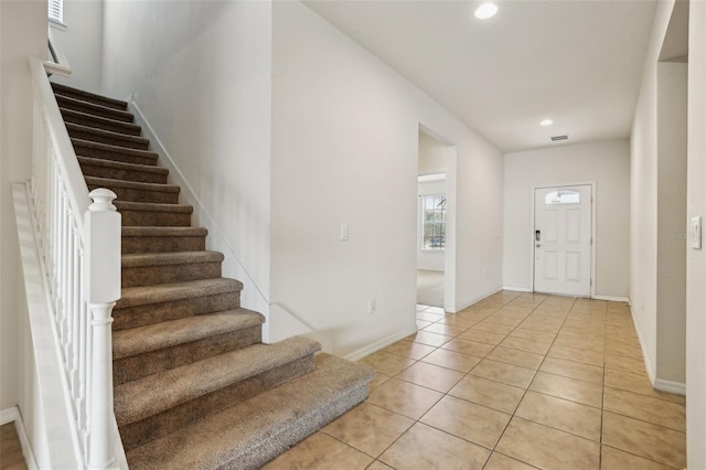 entrance foyer with light tile patterned floors