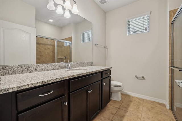 bathroom featuring an enclosed shower, vanity, tile patterned floors, and toilet