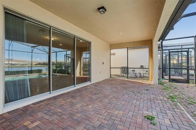 view of patio with a water view