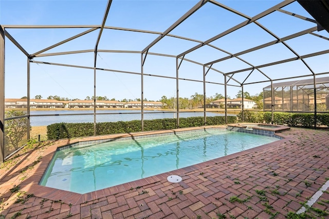 view of swimming pool featuring a water view, an in ground hot tub, a lanai, and a patio area