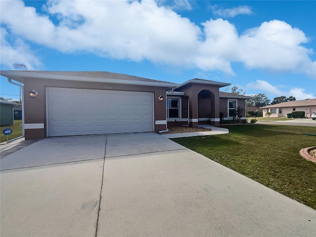 view of front of house with a garage and a front yard