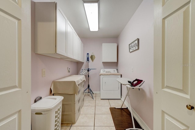 laundry room with light tile patterned flooring and cabinets