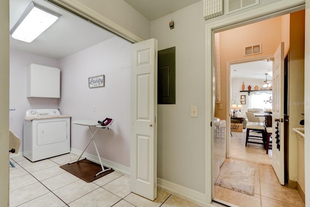 laundry room with washer / dryer, electric panel, cabinets, and light tile patterned flooring