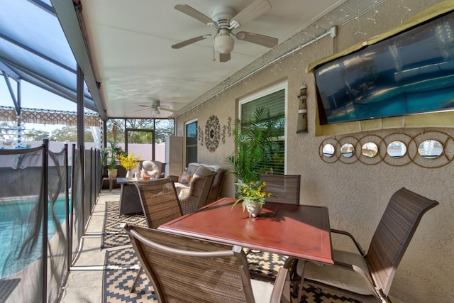 sunroom / solarium with ceiling fan