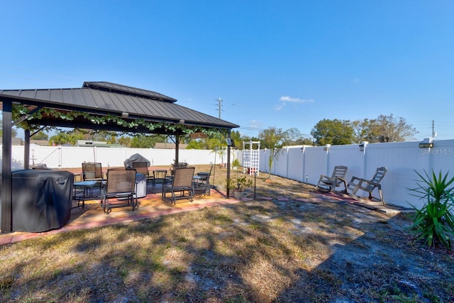 view of yard with a gazebo and a patio area