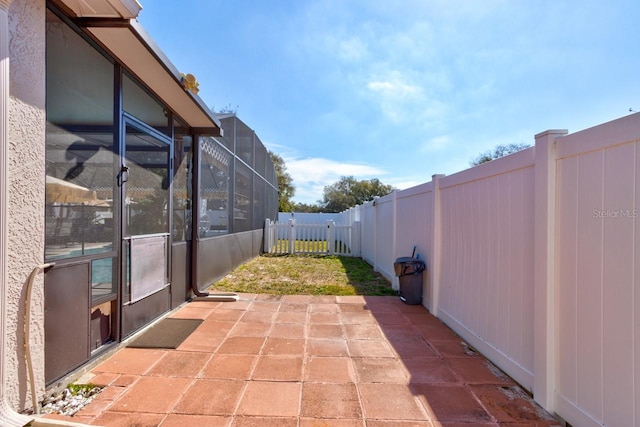 view of patio with a lanai