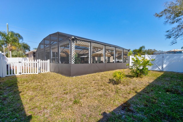 view of yard with glass enclosure