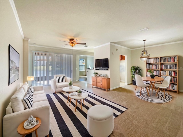 living room with crown molding, light carpet, ceiling fan, and a textured ceiling