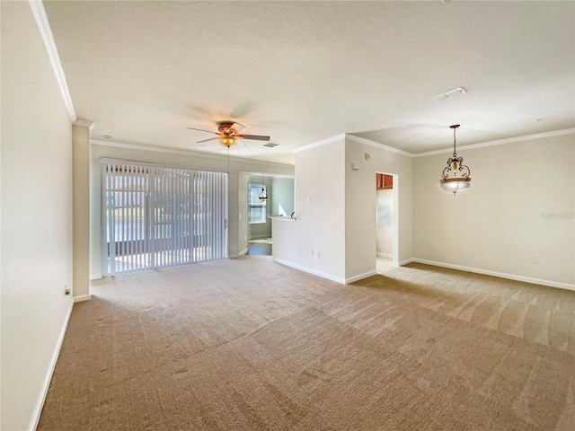 unfurnished room with a textured ceiling, ornamental molding, ceiling fan, and carpet flooring