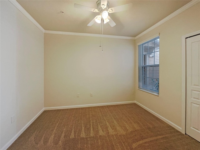 carpeted spare room featuring ceiling fan and ornamental molding