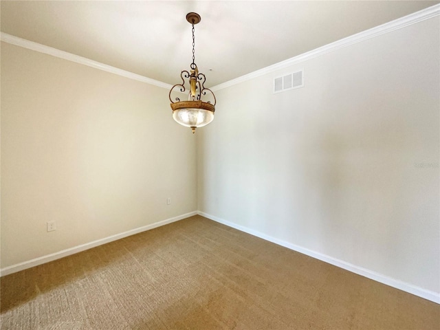 spare room featuring crown molding and carpet