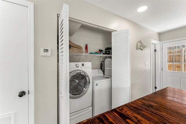 laundry room featuring independent washer and dryer