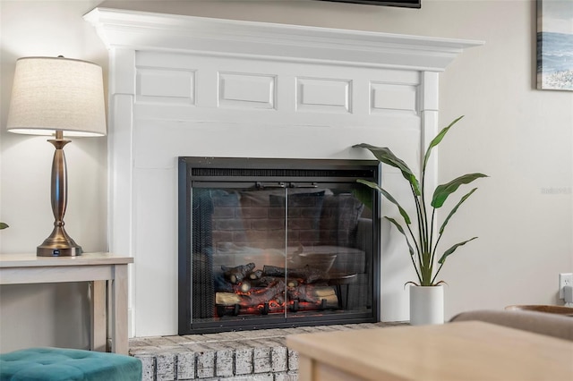 interior details with a brick fireplace