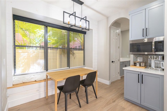 dining room with a healthy amount of sunlight and light hardwood / wood-style floors