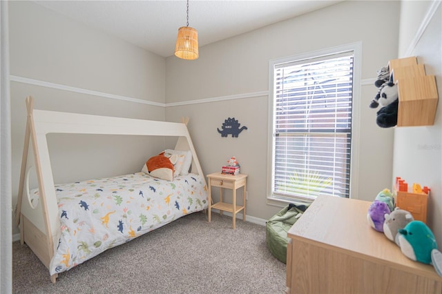 bedroom with multiple windows and carpet flooring