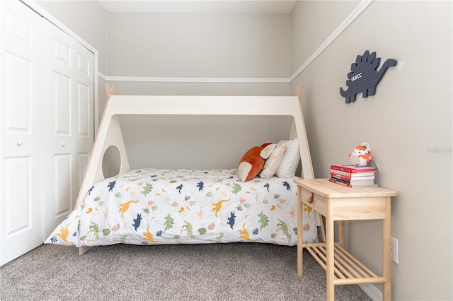 carpeted bedroom featuring a closet