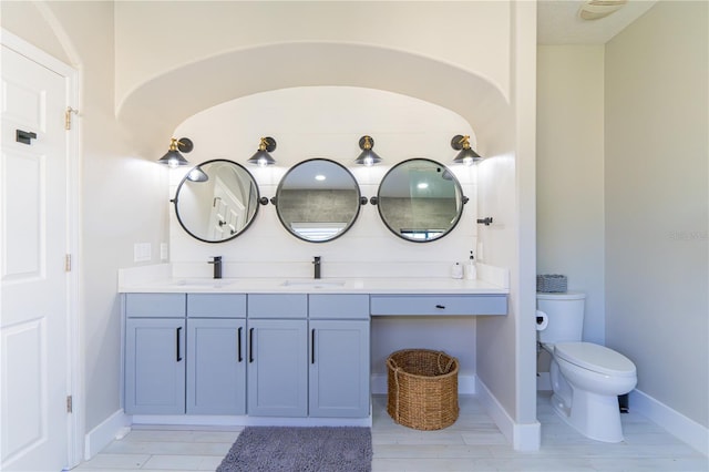 bathroom featuring hardwood / wood-style flooring, vanity, and toilet