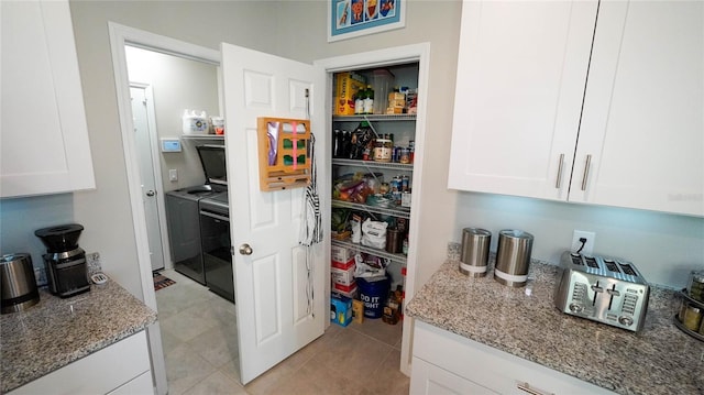 pantry featuring washer and dryer