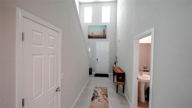 interior space featuring sink and a high ceiling