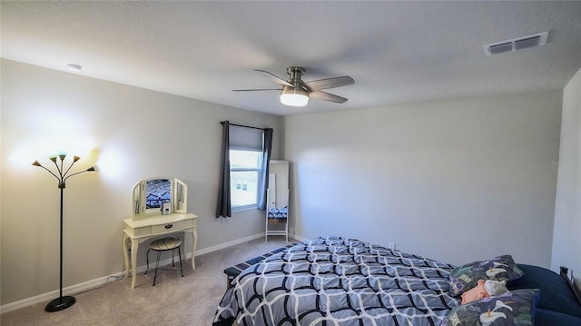 bedroom with ceiling fan and carpet flooring