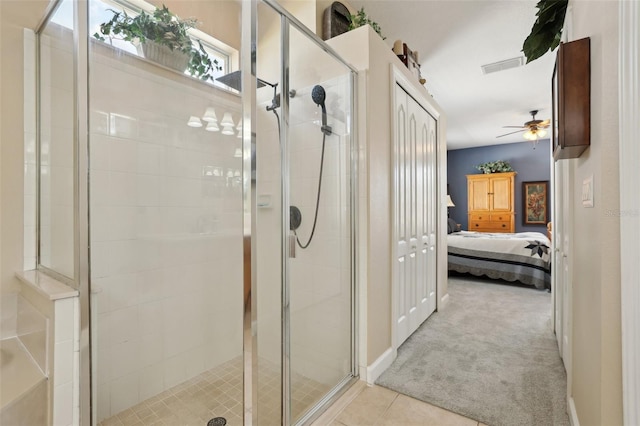 bathroom featuring tile patterned floors, ceiling fan, and walk in shower