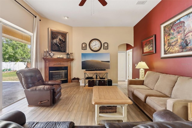 living room featuring ceiling fan and light hardwood / wood-style flooring