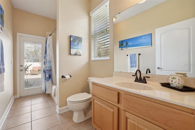 full bathroom with vanity, a wealth of natural light, tile patterned floors, and toilet