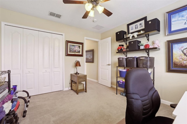 home office with light carpet and ceiling fan