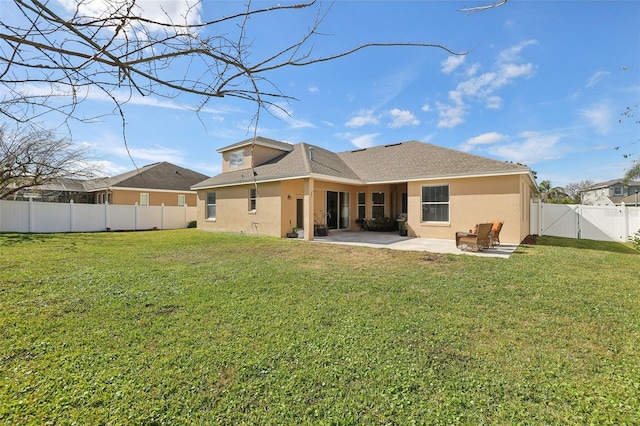 back of property featuring a patio and a lawn