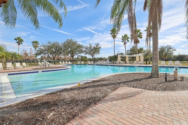 view of swimming pool with a pergola