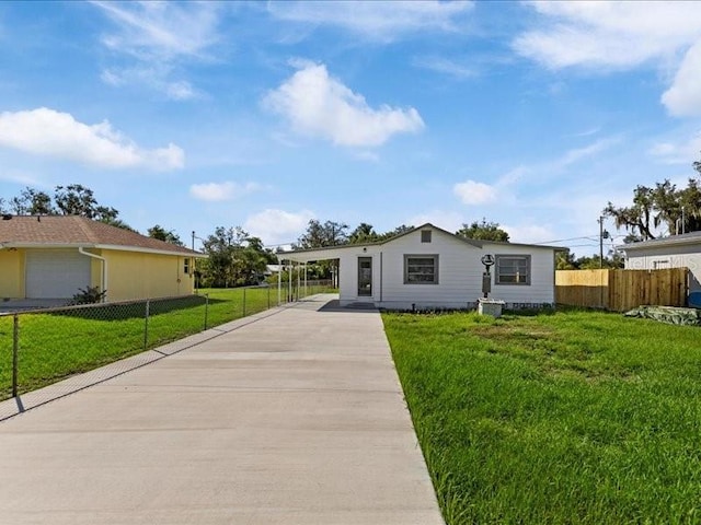 ranch-style house with a carport and a front yard