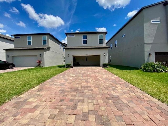 front facade with a garage and a front yard