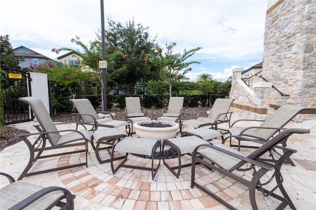 view of patio with a fire pit