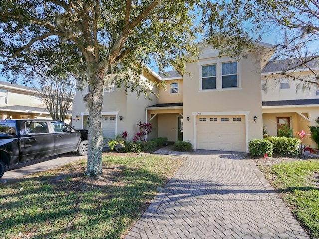 multi unit property featuring a garage