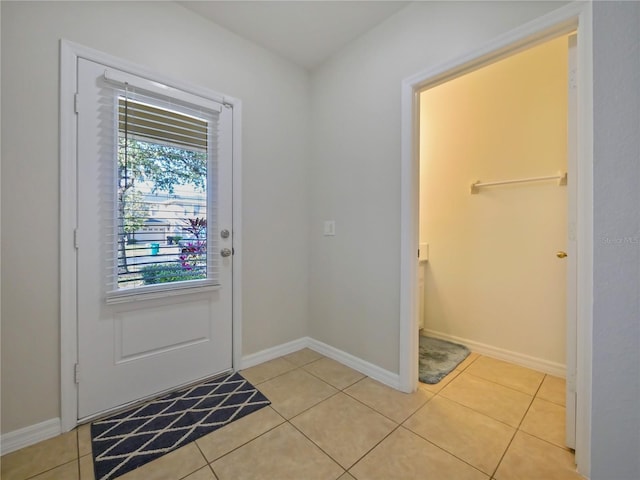 doorway to outside featuring light tile patterned floors