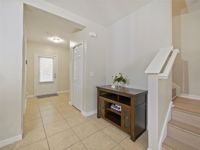 entryway featuring light tile patterned floors