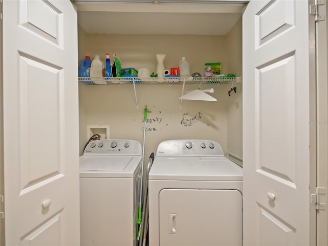 clothes washing area featuring washer and dryer