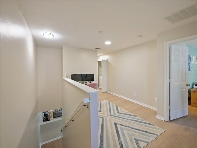 corridor featuring light hardwood / wood-style flooring