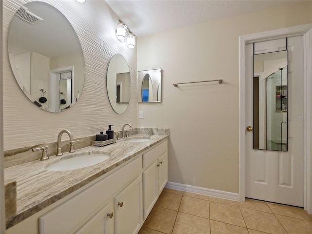 bathroom with vanity and tile patterned floors